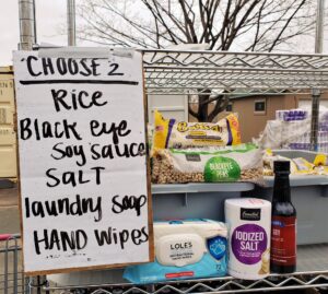 A sign reading choose two with a list of choice rack items